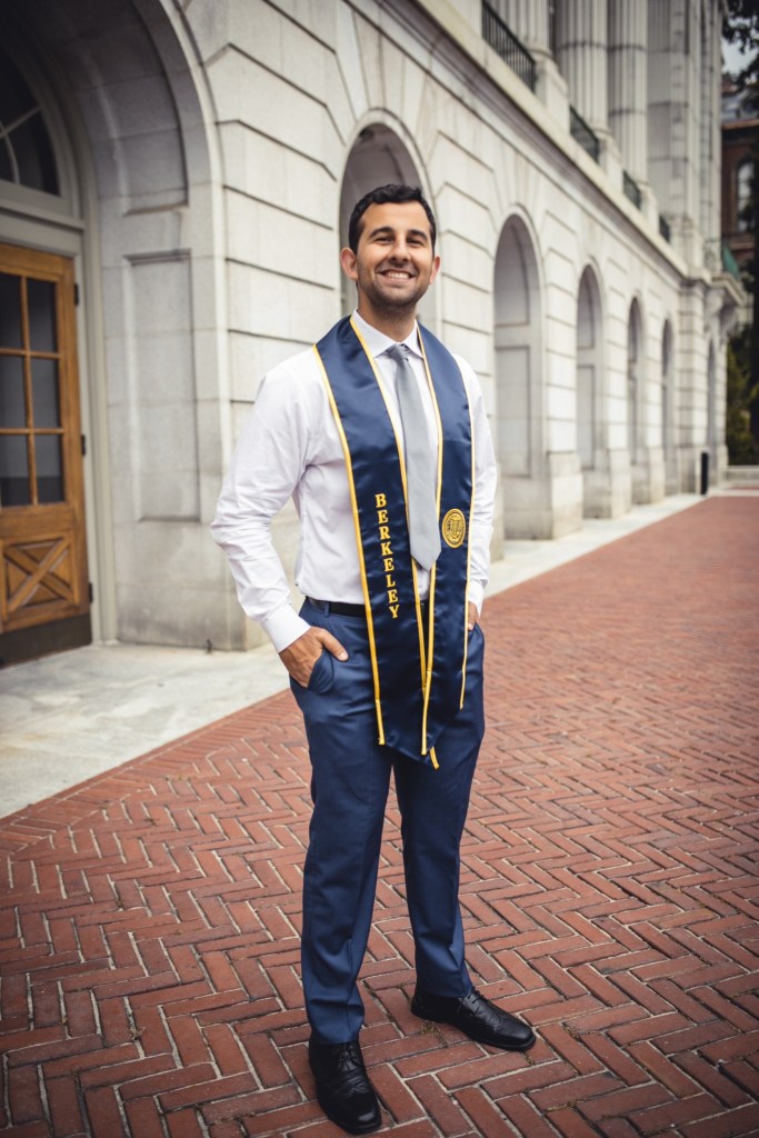 Jacob Markarian wearing a UC Berkeley graduation stole and formal attire on the UC Berkeley campus.